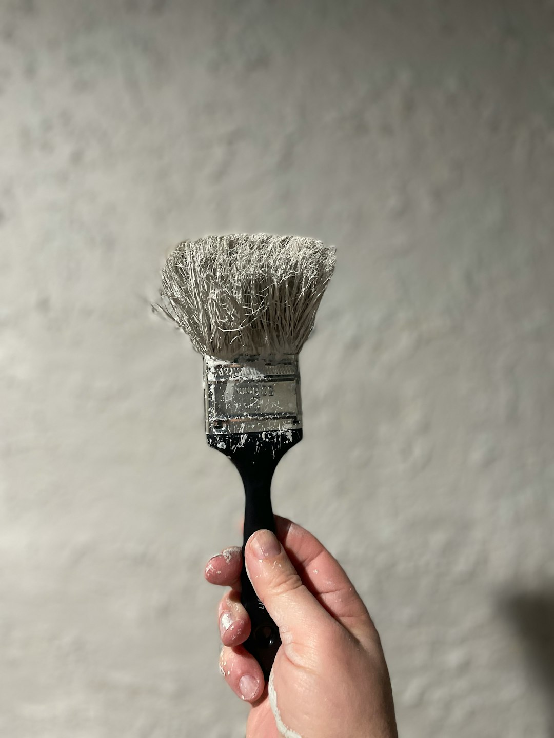 why-choose-us person-holding-black-and-white-brush-ffyvai6t430